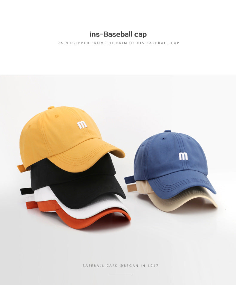 A Cap Featuring an Embroidered M, Designed As a Soft Sunshade Hat,