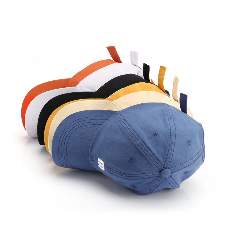 A Cap Featuring an Embroidered M, Designed As a Soft Sunshade Hat,