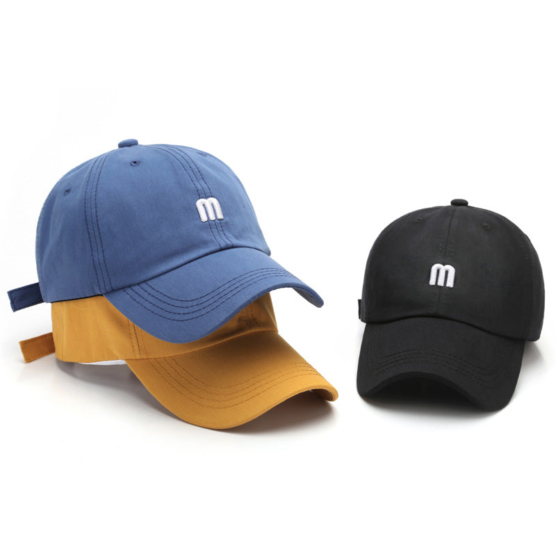 A Cap Featuring an Embroidered M, Designed As a Soft Sunshade Hat,