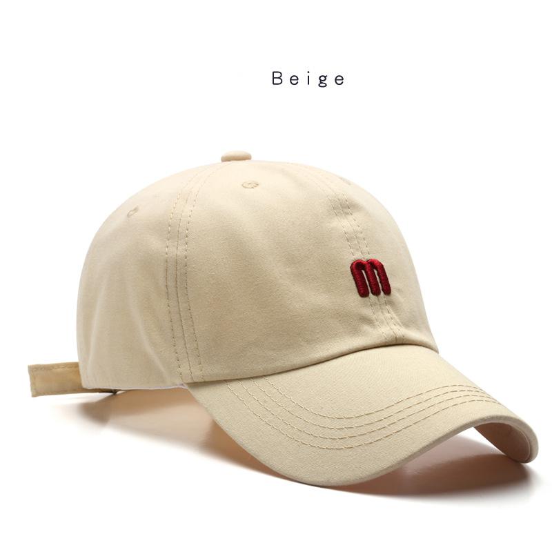 A Cap Featuring an Embroidered M, Designed As a Soft Sunshade Hat,