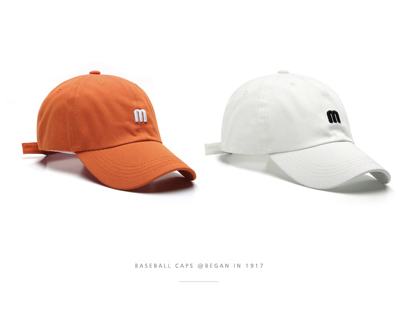 A Cap Featuring an Embroidered M, Designed As a Soft Sunshade Hat,