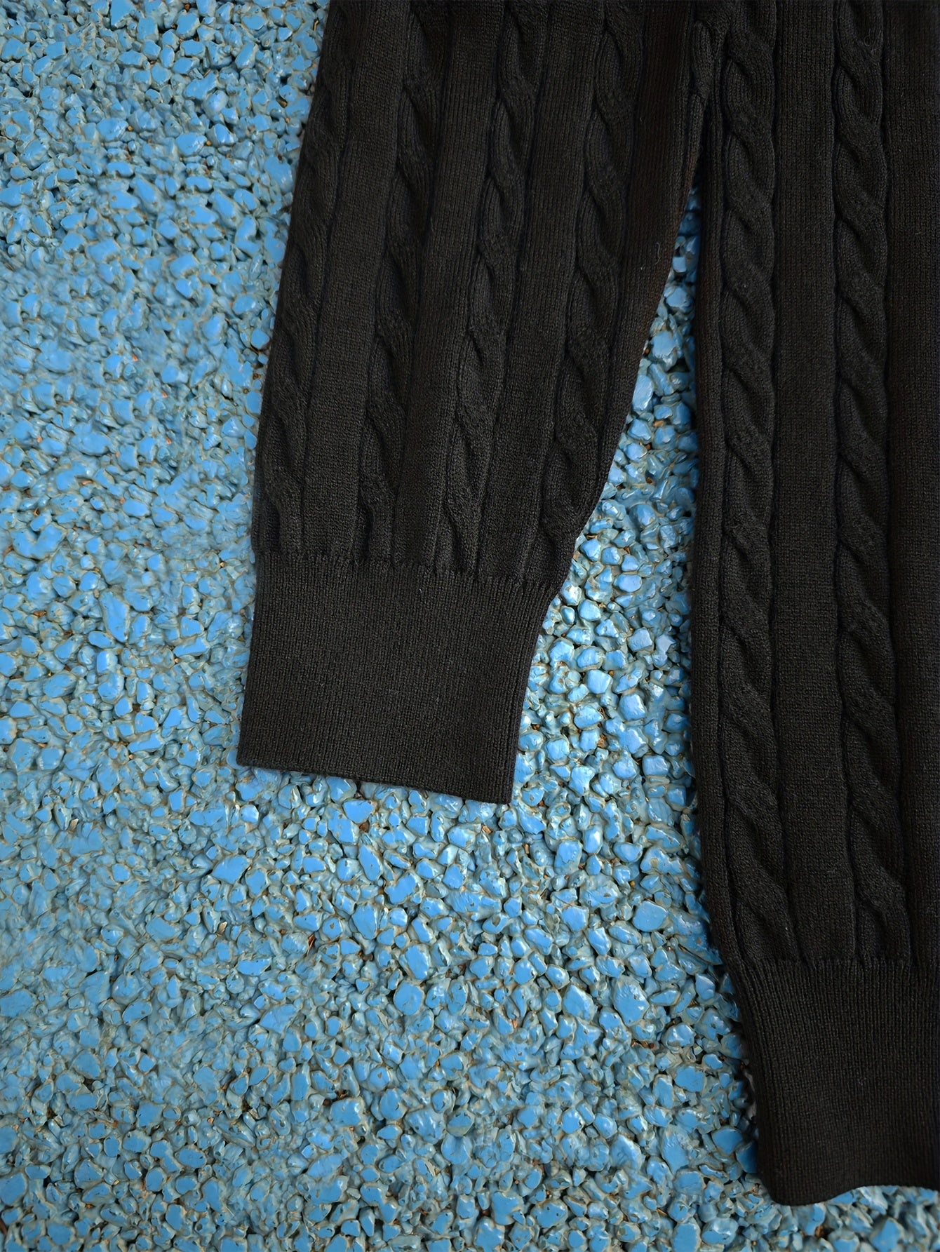 A Knitted Sweater for Teenage Featuring a Twisted Pattern .