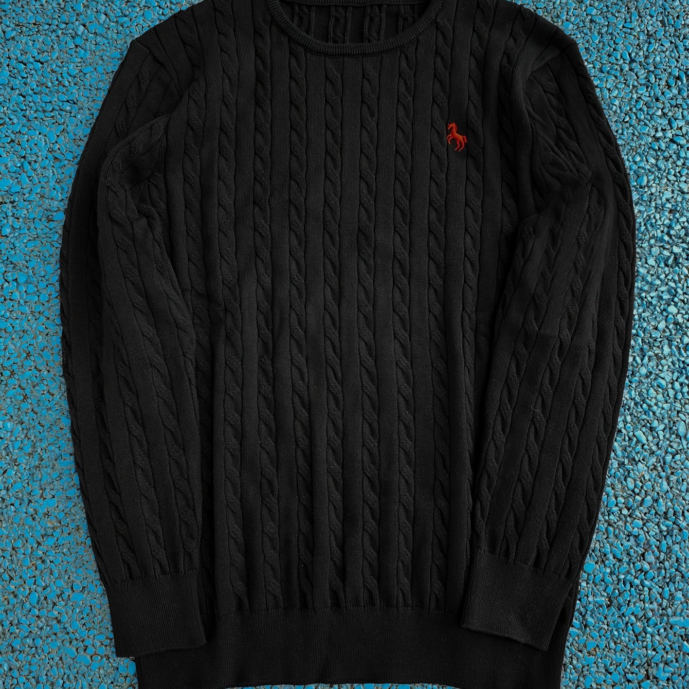 A Knitted Sweater for Teenage Featuring a Twisted Pattern .
