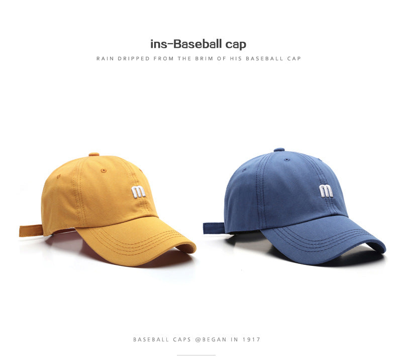 A Cap Featuring an Embroidered M, Designed As a Soft Sunshade Hat,