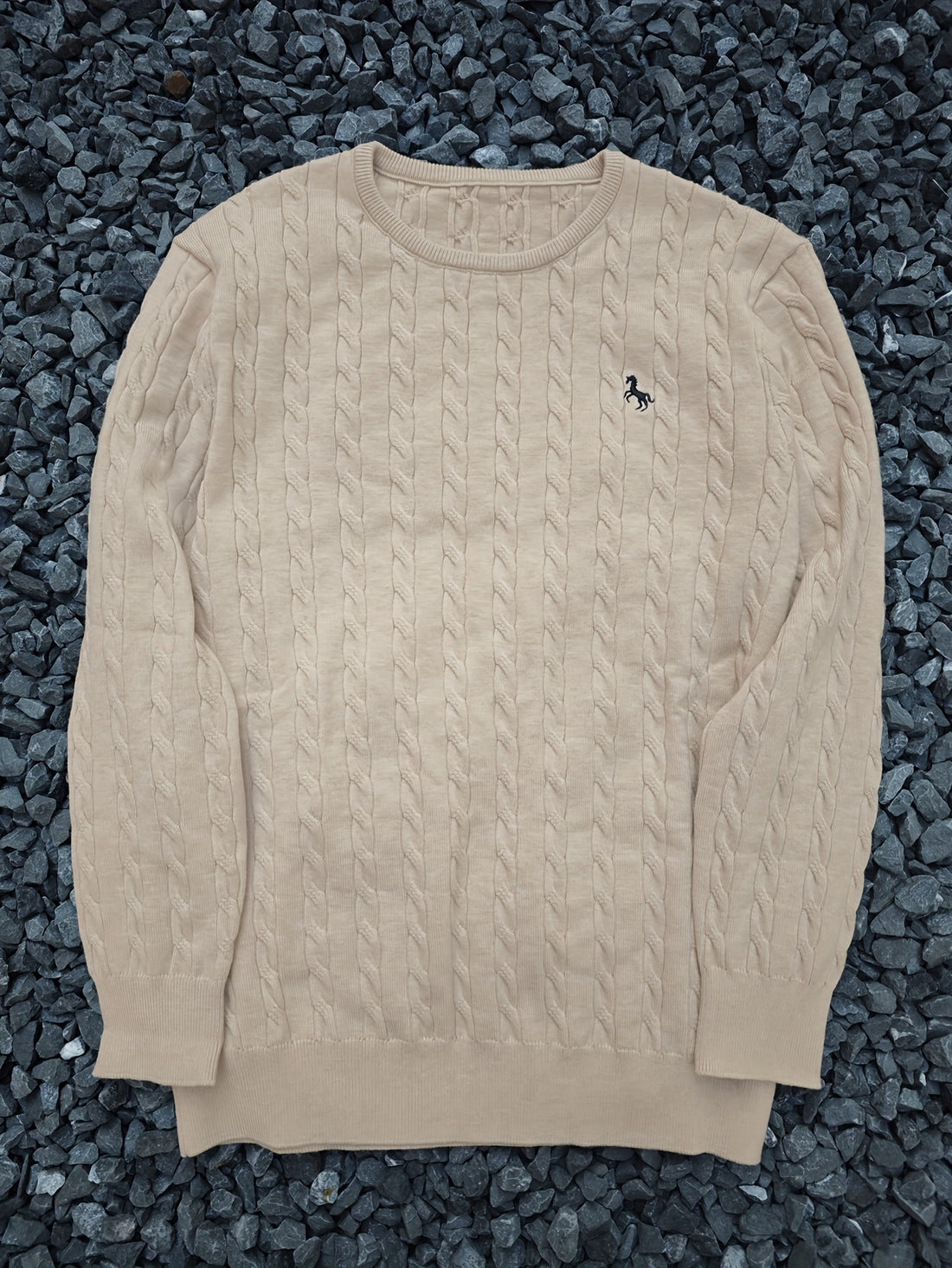 A Knitted Sweater for Teenage Featuring a Twisted Pattern .