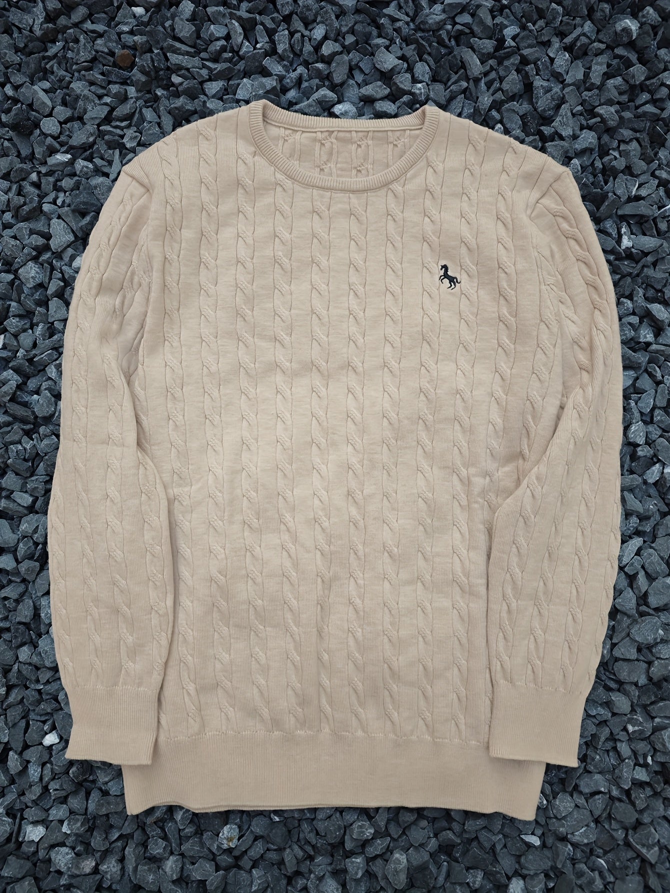 A Knitted Sweater for Teenage Featuring a Twisted Pattern .