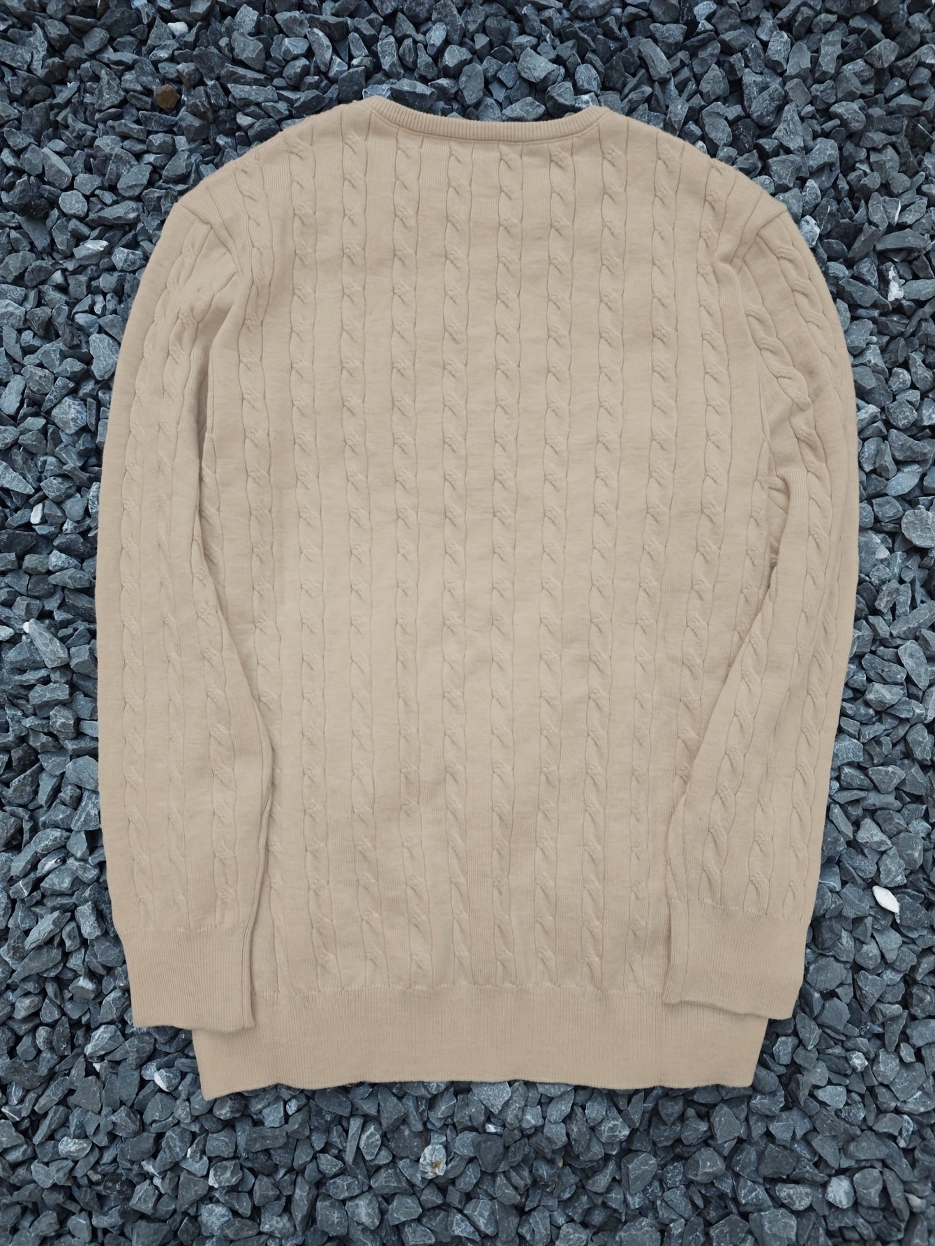 A Knitted Sweater for Teenage Featuring a Twisted Pattern .