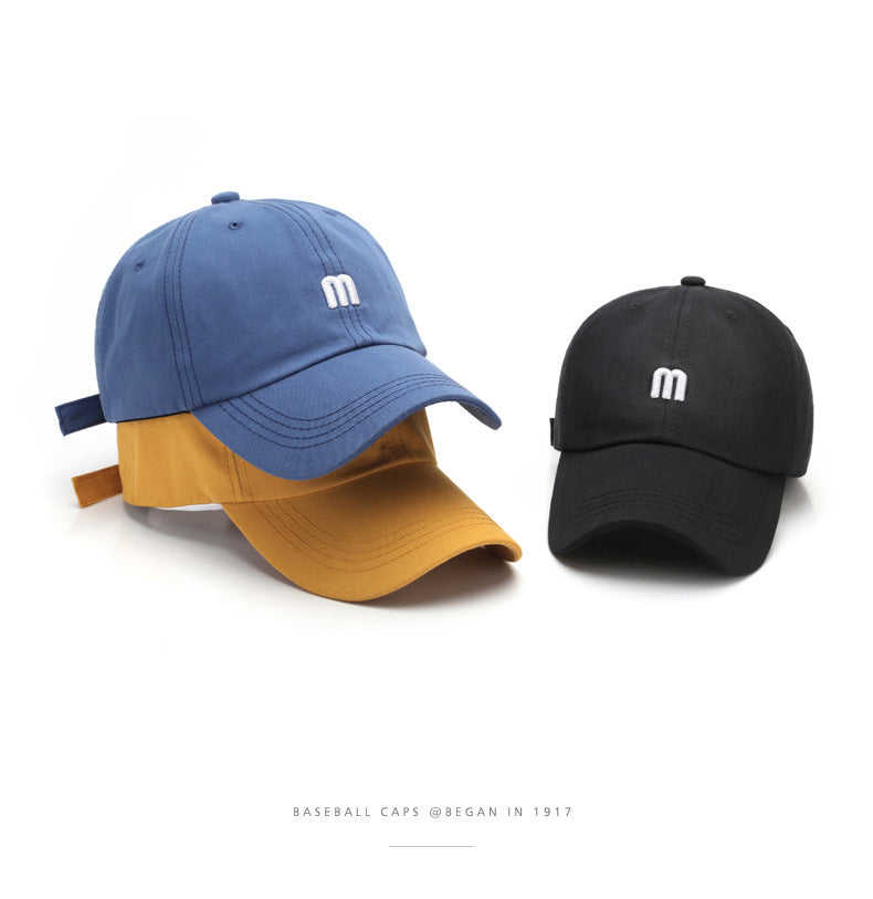 A Cap Featuring an Embroidered M, Designed As a Soft Sunshade Hat,