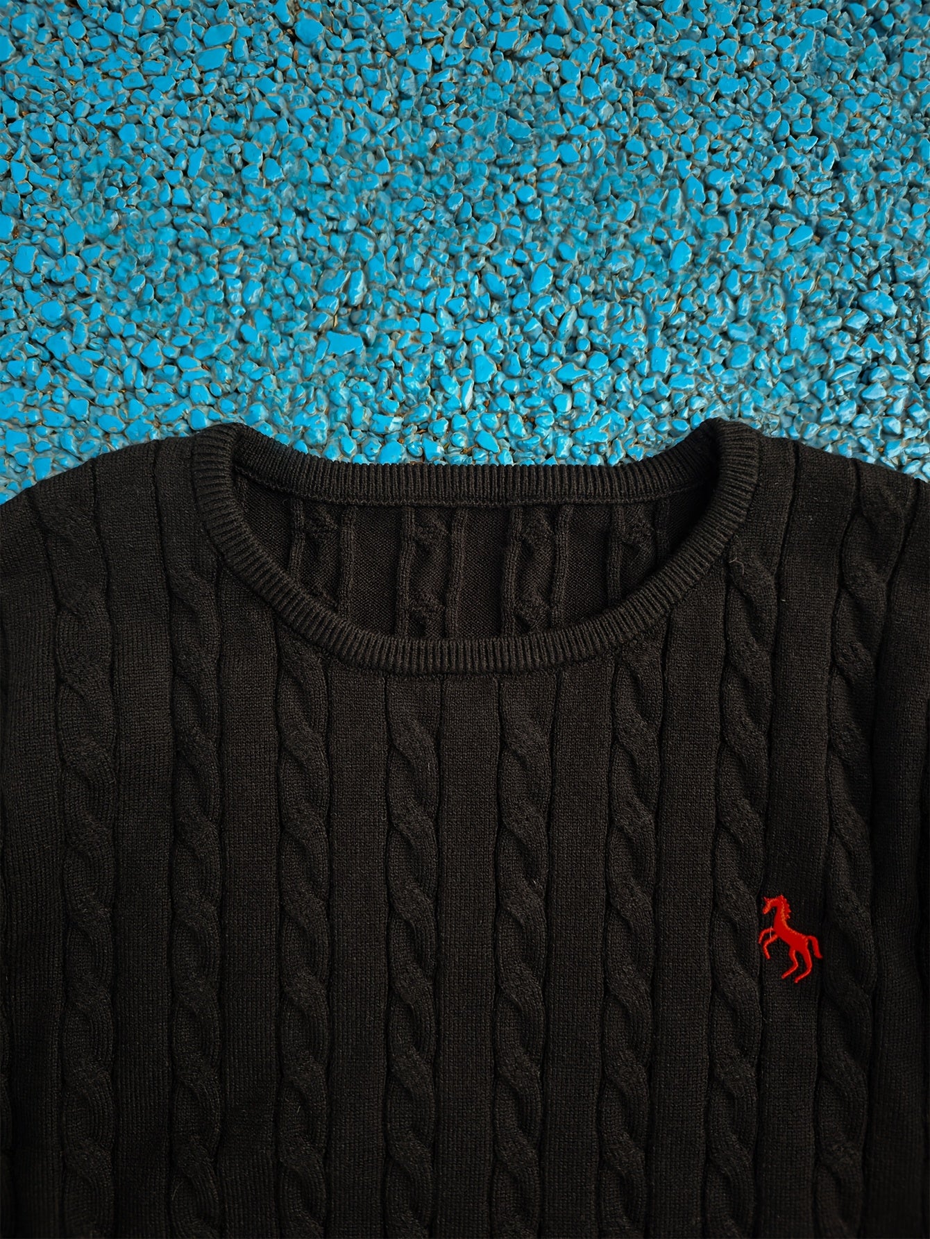 A Knitted Sweater for Teenage Featuring a Twisted Pattern .