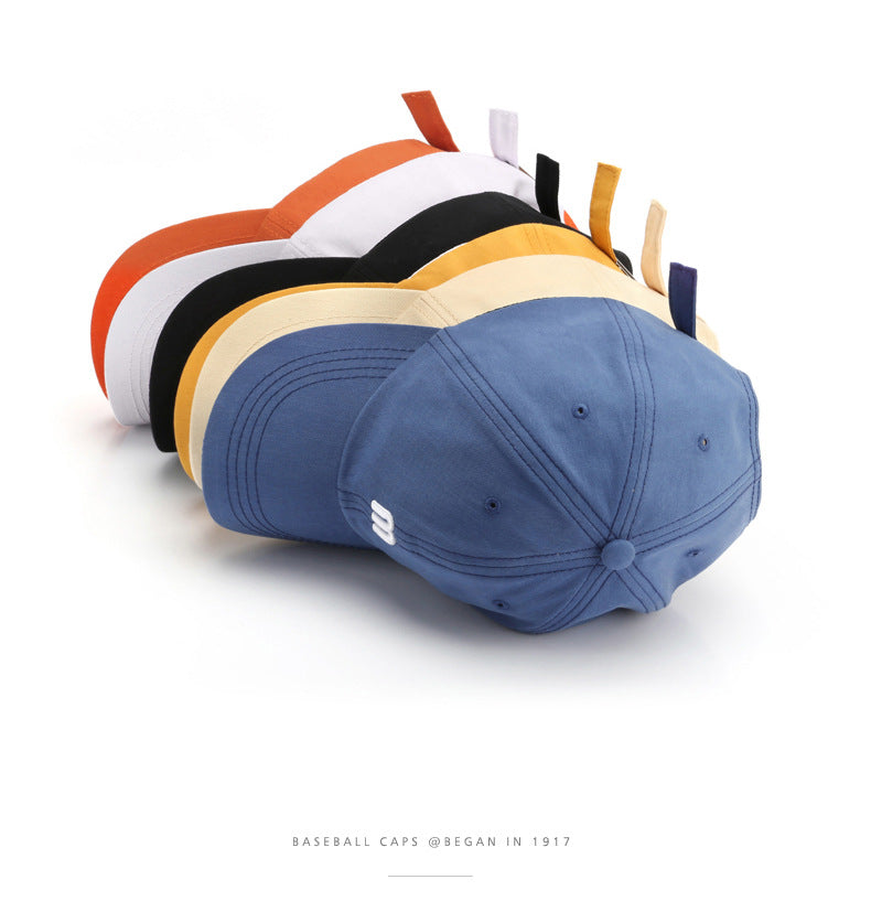 A Cap Featuring an Embroidered M, Designed As a Soft Sunshade Hat,