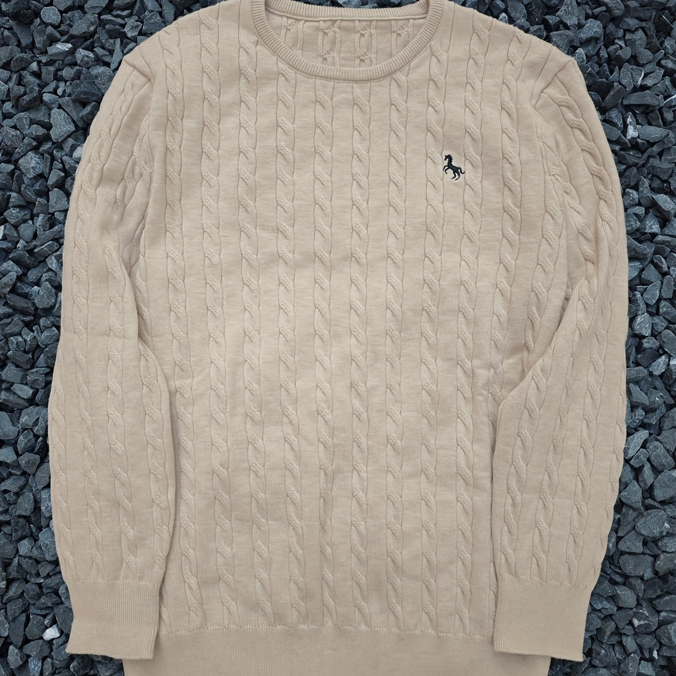 A Knitted Sweater for Teenage Featuring a Twisted Pattern .