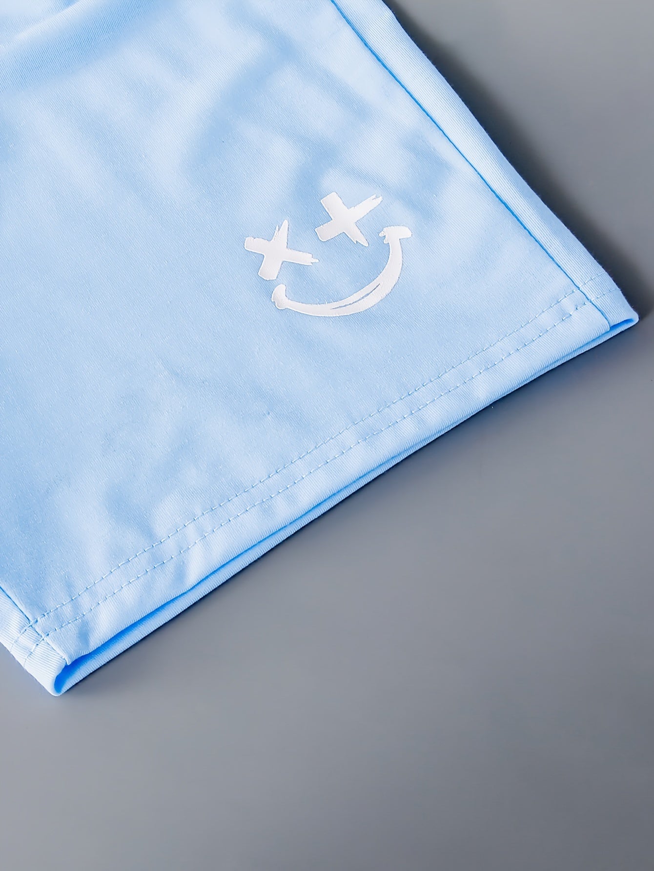 3pcs Boys Casual Solid Short Sleeve T-shirt & Smile Face Print Shorts.