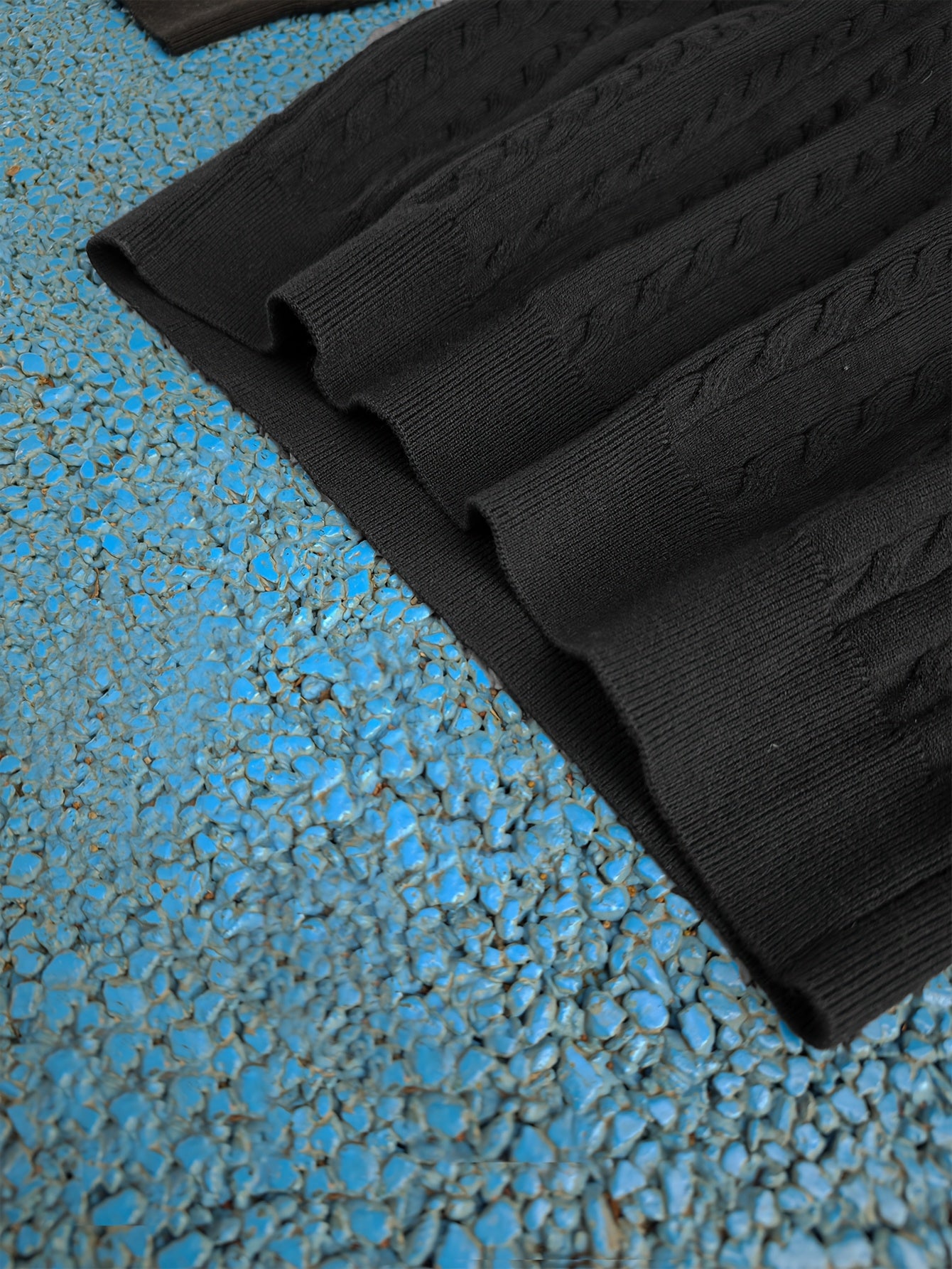 A Knitted Sweater for Teenage Featuring a Twisted Pattern .