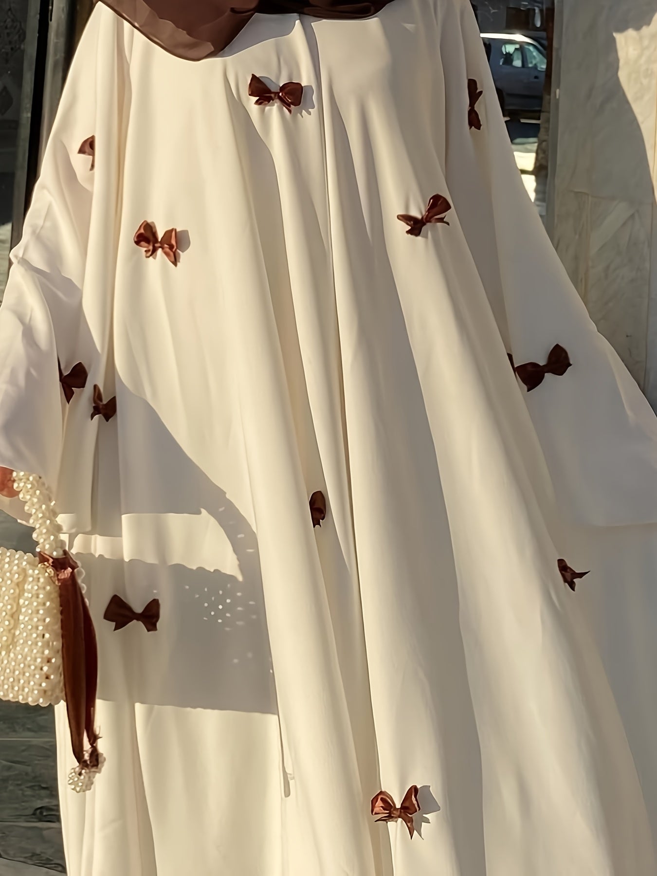 Elegant White Abaya with Blue Bow Accents - ./MH